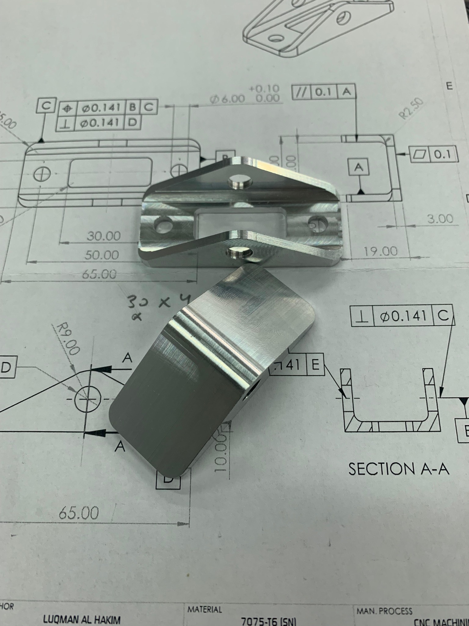 Technical drawing and machined Formula Student part